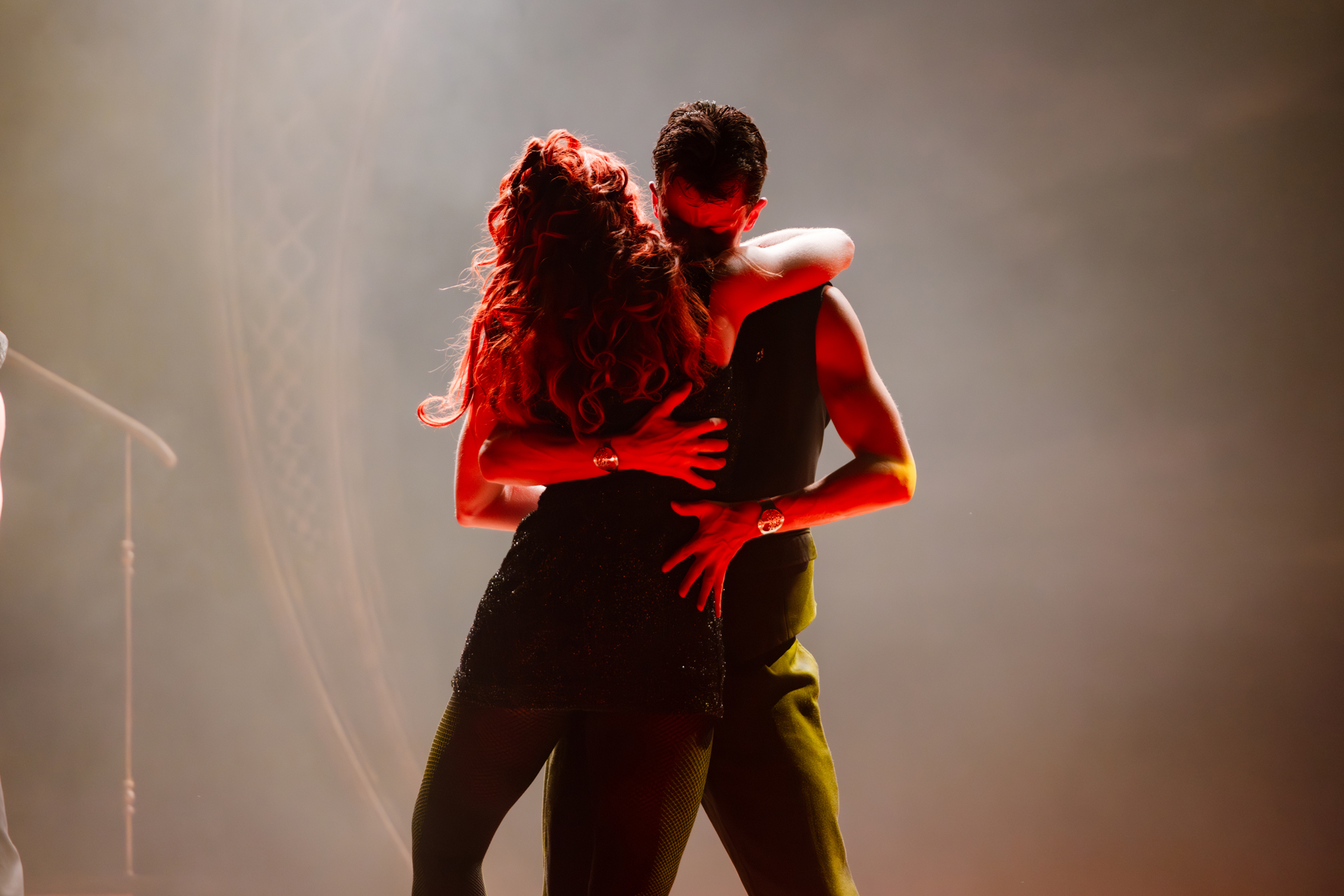 Two dancers dancing closely, to promote the event Adam Garcia's Emerald Storm