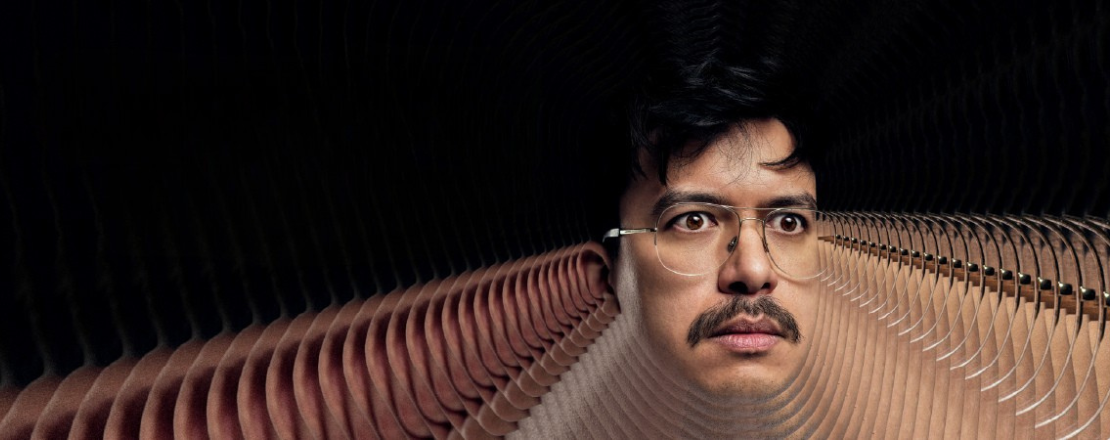 Comedian Phil Wang on a black background to promote his comedy show at the Victoria Theatre Halifax 